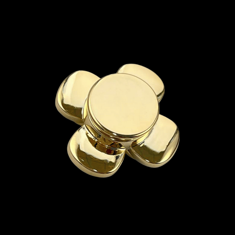 Gold fidget spinner on a black background