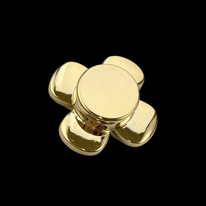 Gold fidget spinner on a black background
