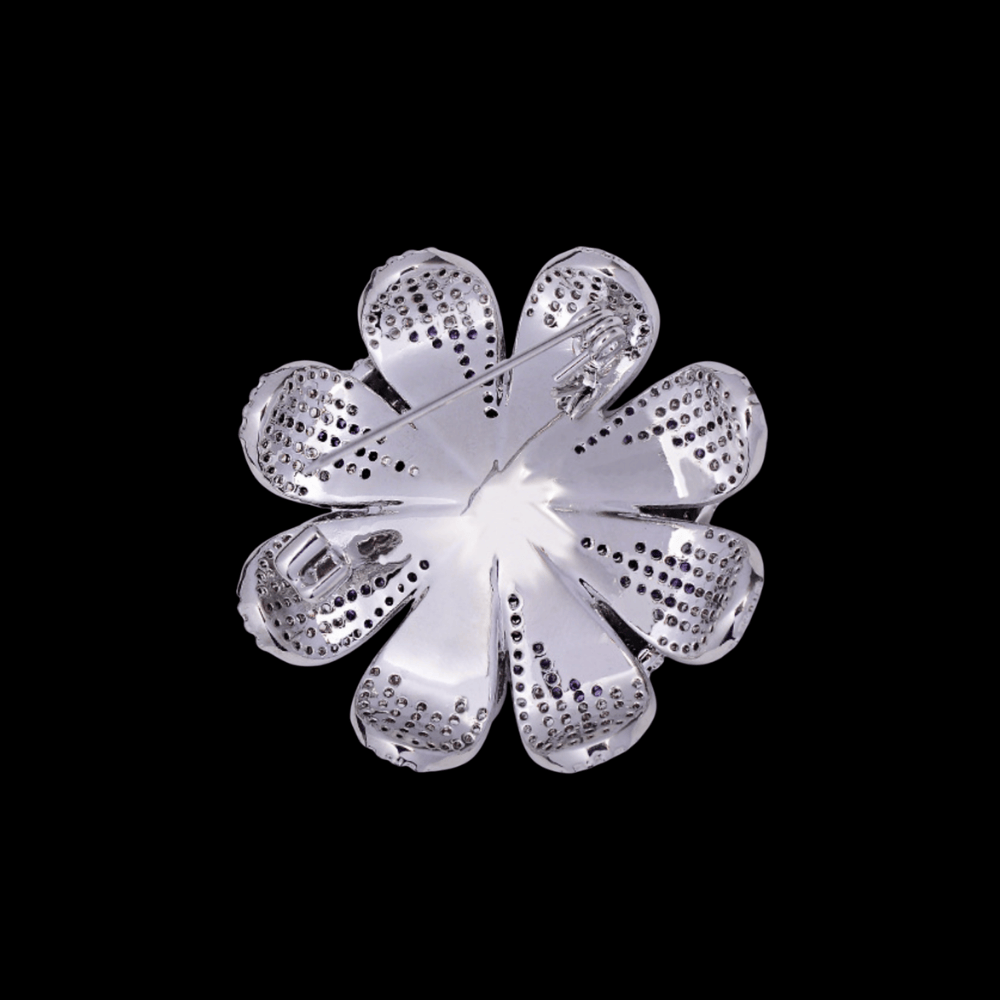 AVELIA silver daisy brooch featuring layered petals with a gradient effect from purple center to clear crystal edges.