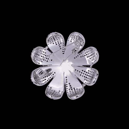 AVELIA silver daisy brooch featuring layered petals with a gradient effect from purple center to clear crystal edges.