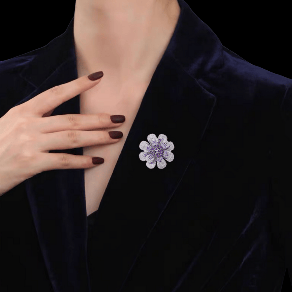 AVELIA silver daisy brooch featuring layered petals with a gradient effect from purple center to clear crystal edges.